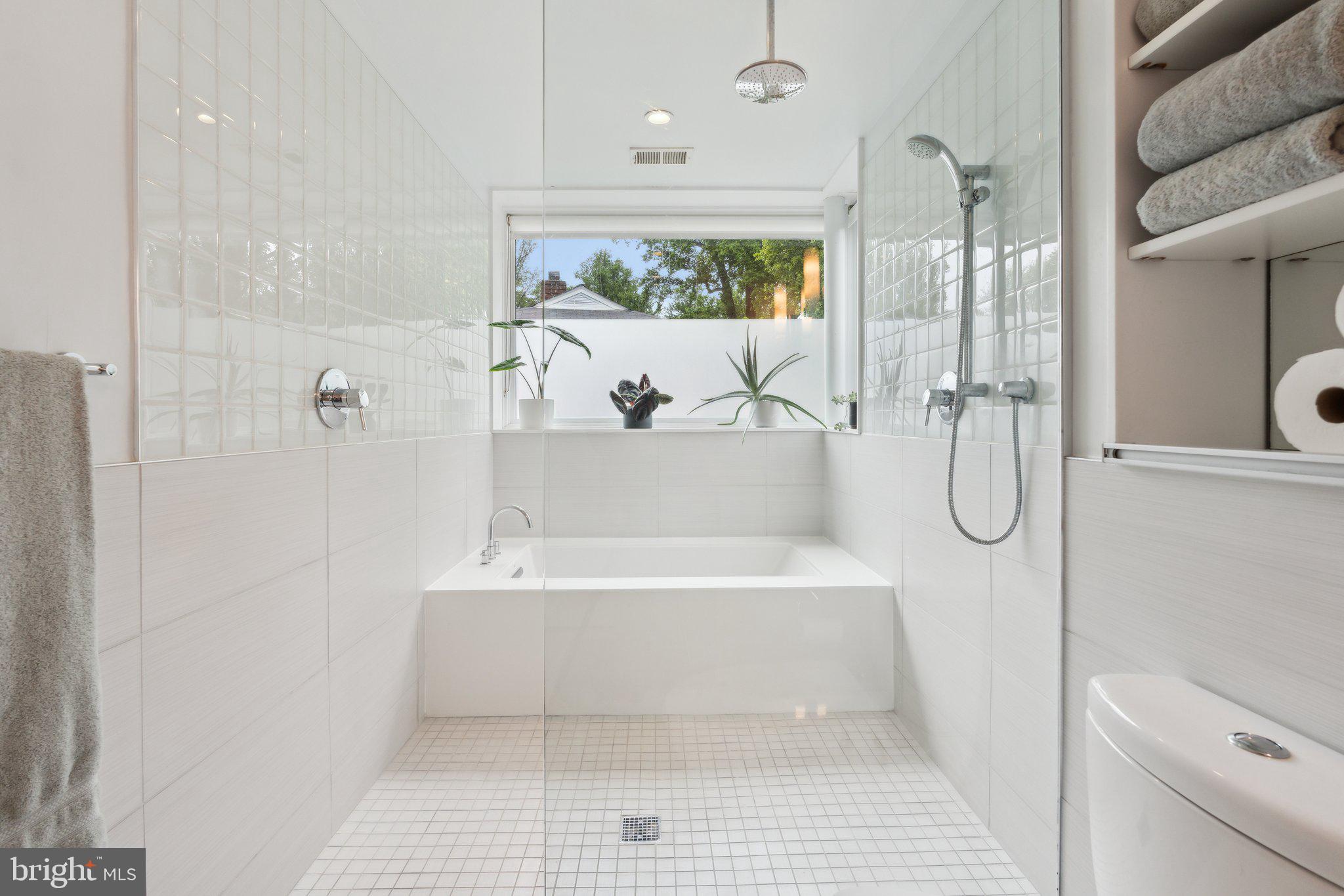5929 Onondaga Road Bethesda, MD 20816 - Photo 19 of 47 a bathroom with a bathtub and a shower