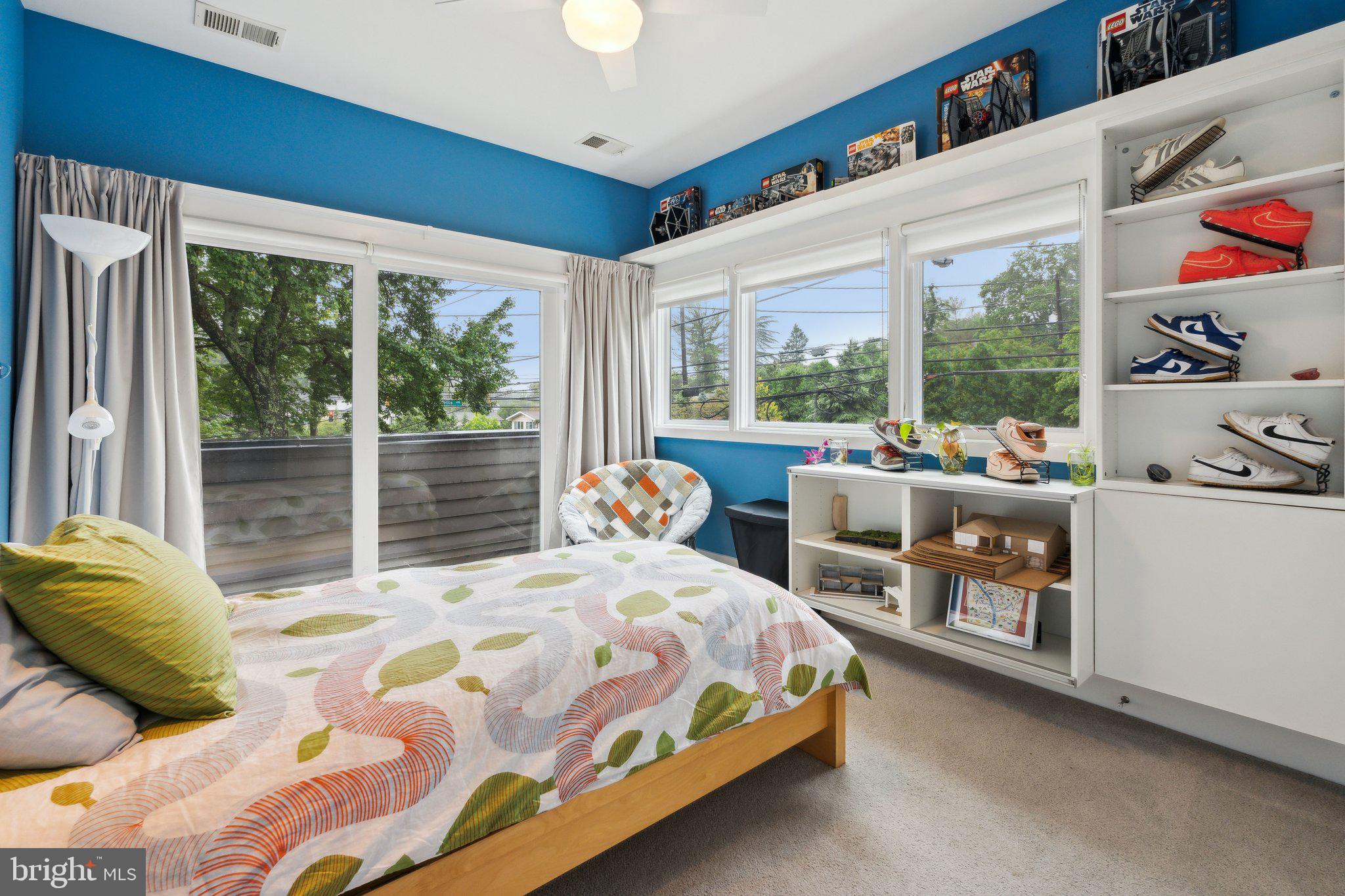 5929 Onondaga Road Bethesda, MD 20816 - Photo 21 of 47 a bedroom with a bed and a large window