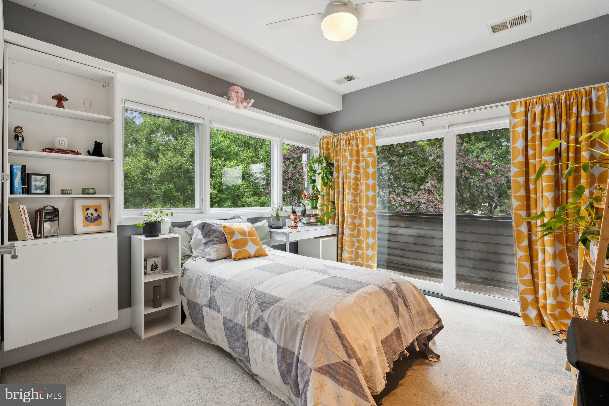 5929 Onondaga Road Bethesda, MD 20816 - Photo 22 of 47 a bed sitting in a bedroom next to a window