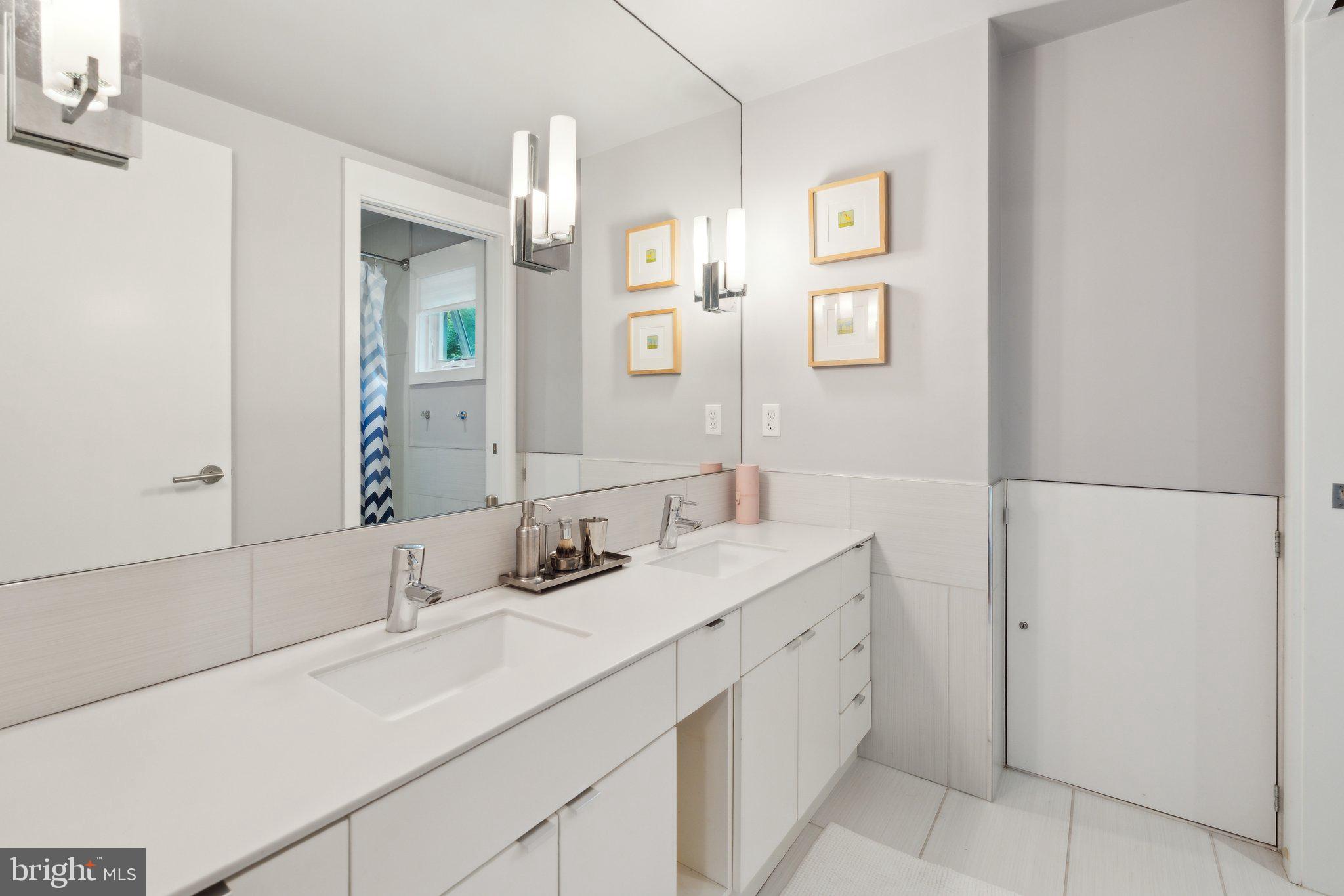 5929 Onondaga Road Bethesda, MD 20816 - Photo 24 of 47 a bathroom with a sink and a mirror