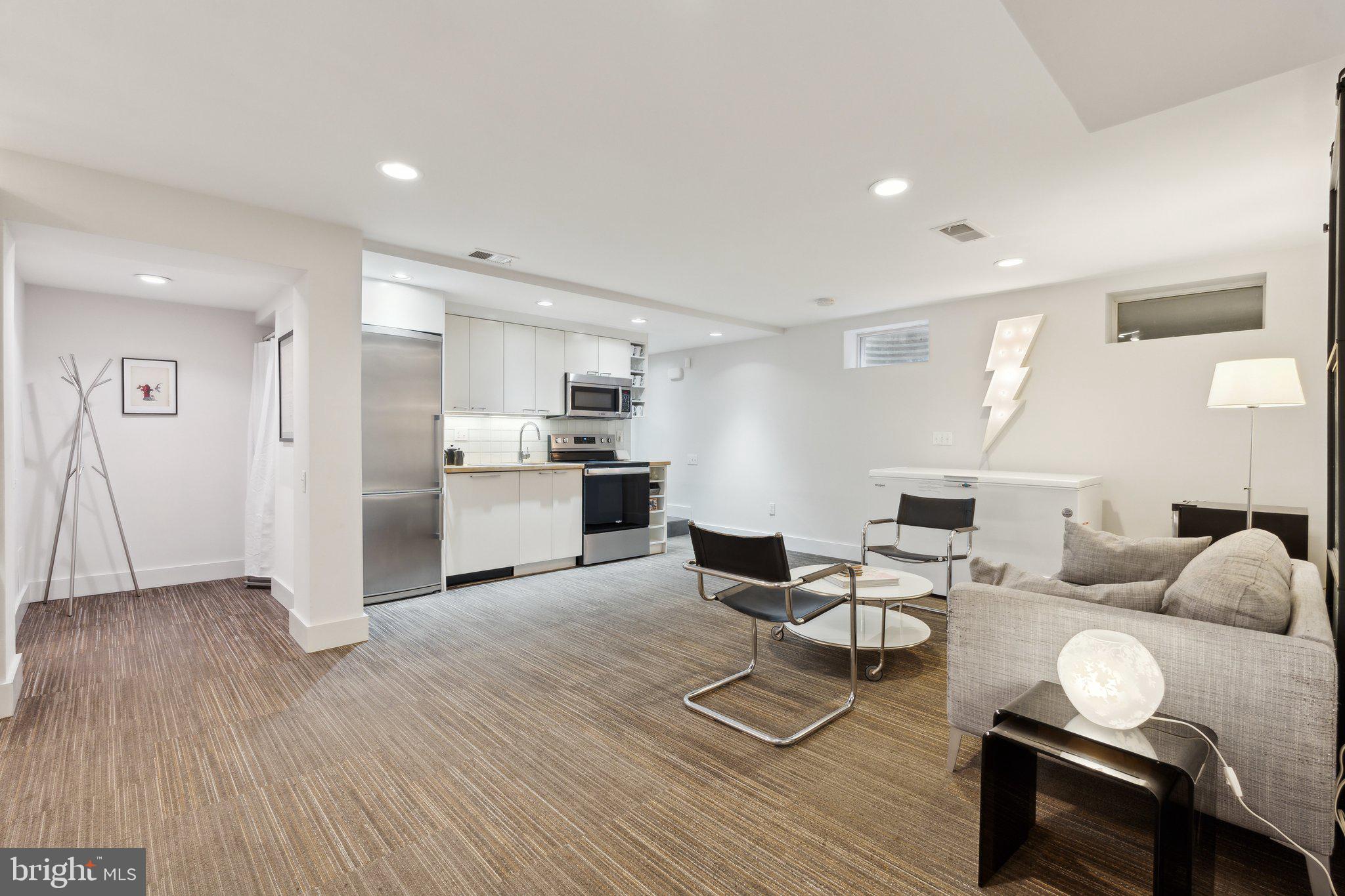 5929 Onondaga Road Bethesda, MD 20816 - Photo 26 of 47 a living room with furniture and kitchen view with wooden floor
