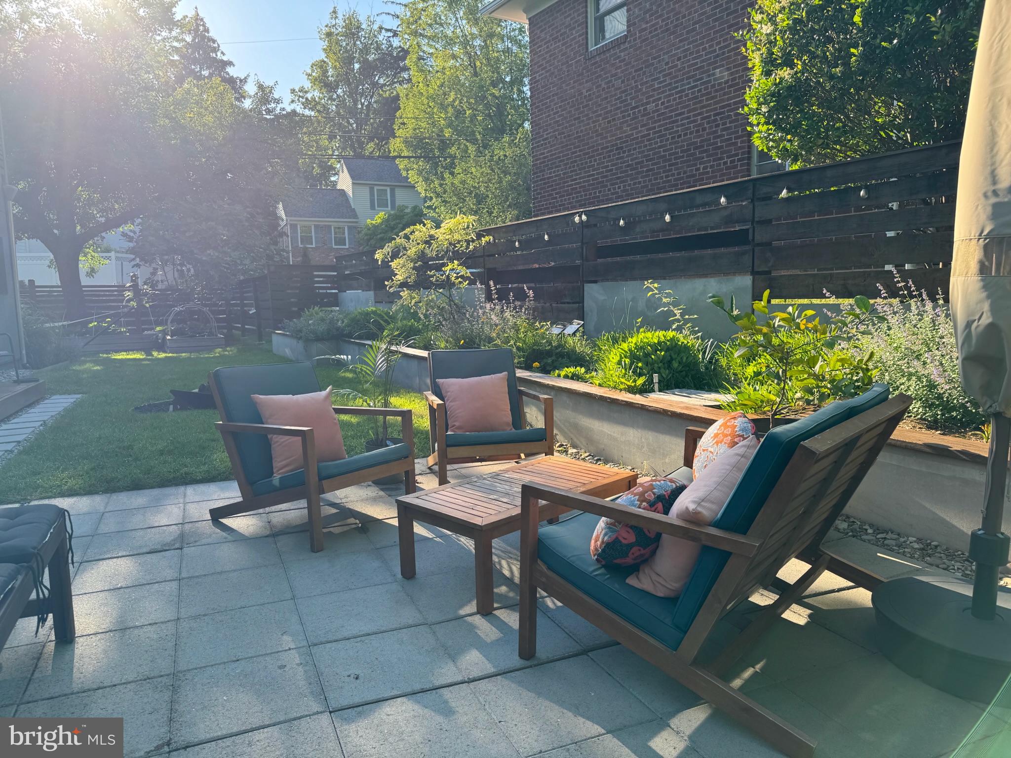 5929 Onondaga Road Bethesda, MD 20816 - Photo 45 of 47 a backyard of a house with outdoor seating