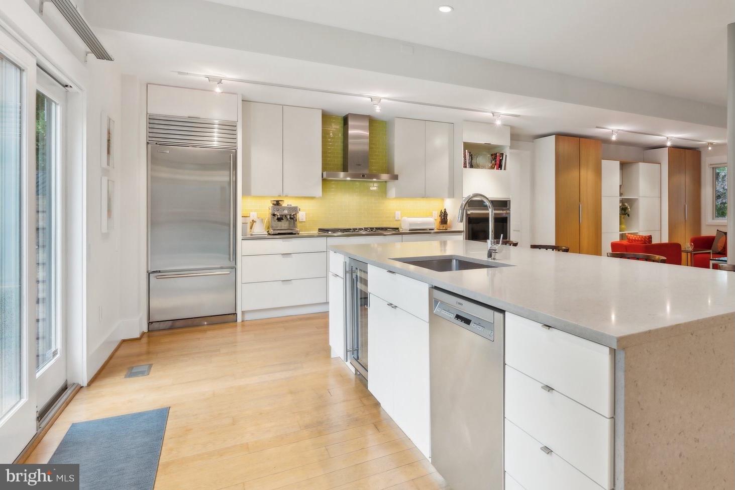 5929 Onondaga Road Bethesda, MD 20816 - Photo 7 of 47 a kitchen with stainless steel appliances granite countertop a sink and cabinets