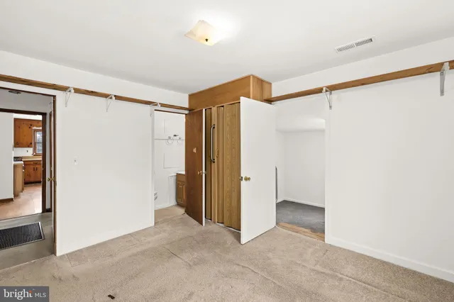 a view of room with walk in closet and closet