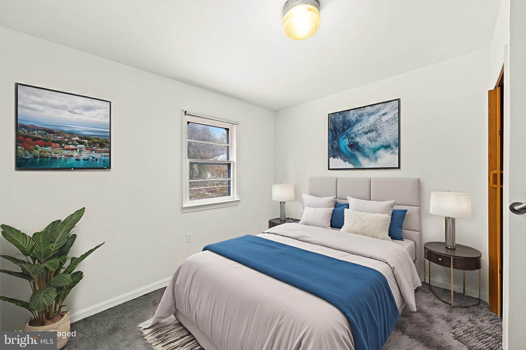 11604 Maple Tree Court Orange, VA 22960 - Photo 21 of 39 a bedroom with a large bed and a potted plant