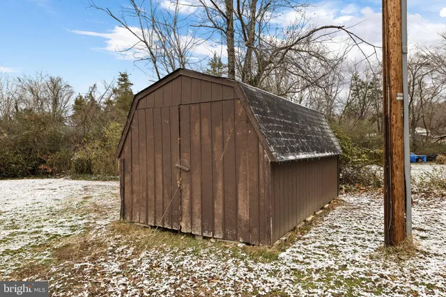 a backyard of a house with large trees