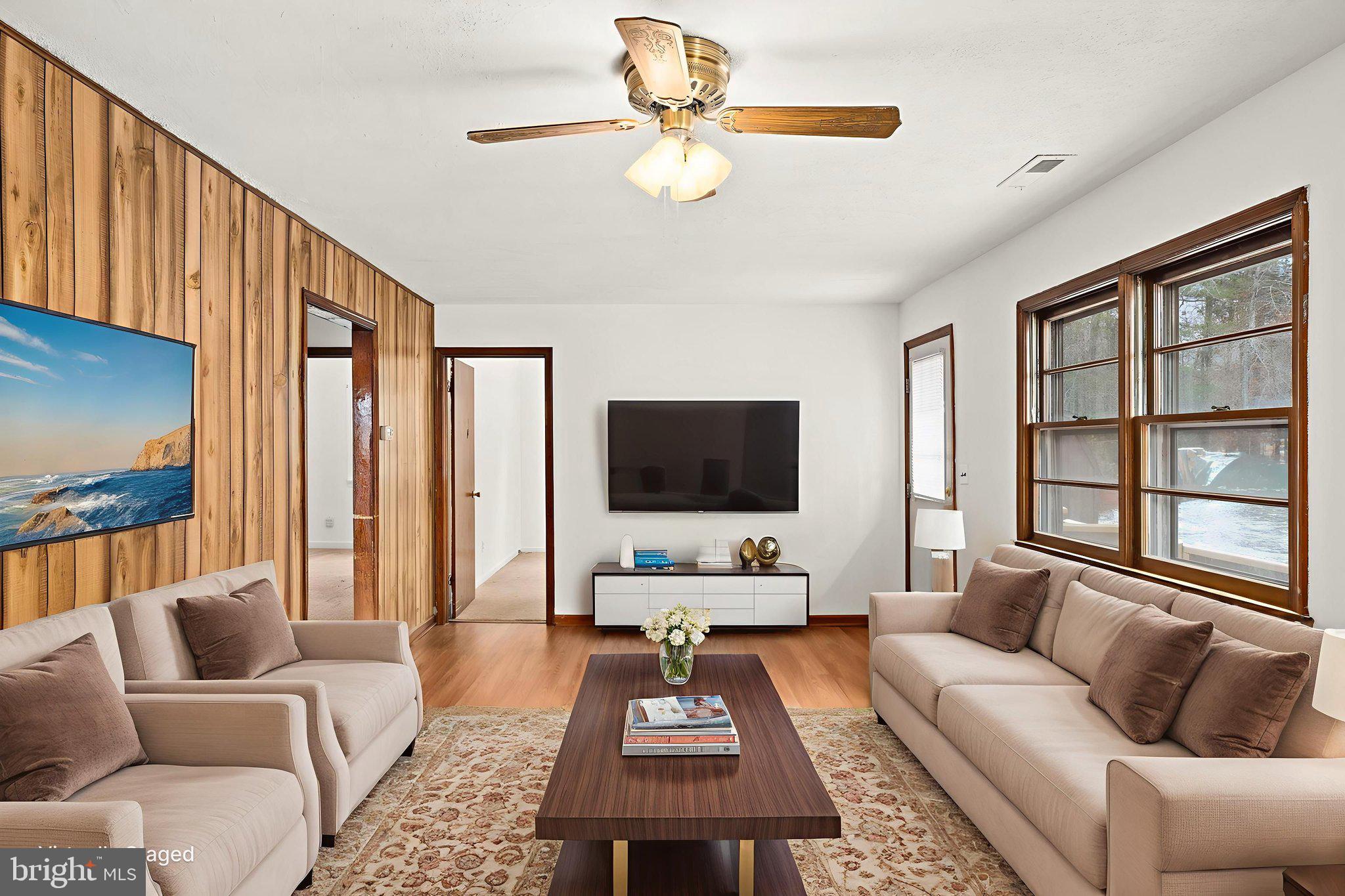 11604 Maple Tree Court Orange, VA 22960 - Photo 7 of 39 a living room with furniture and a flat screen tv