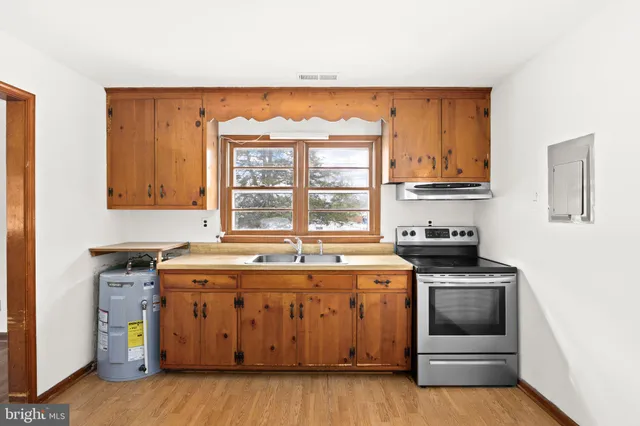 a kitchen with a stove and a microwave