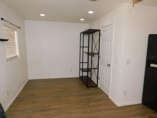 a view of entryway with wooden floor