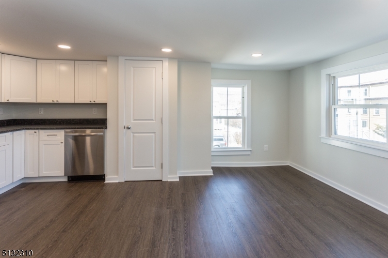 211 Washington Street, Unit 2 Hackettstown, NJ 07840 - Photo 14 of 30 an empty room with wooden floor and windows