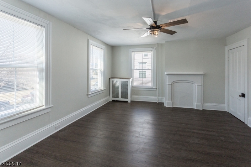 211 Washington Street, Unit 2 Hackettstown, NJ 07840 - Photo 17 of 30 a view of an empty room with a window and wooden floor
