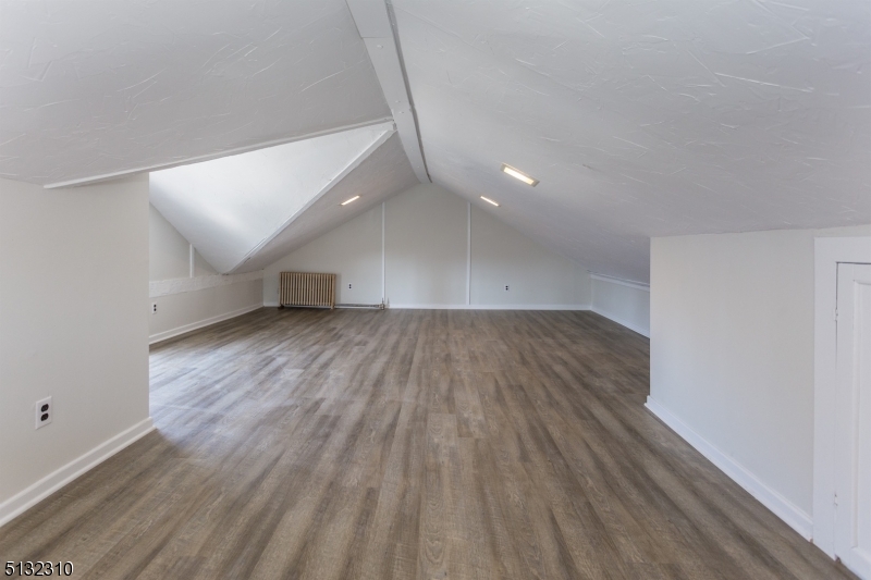 211 Washington Street, Unit 2 Hackettstown, NJ 07840 - Photo 24 of 30 a view of an empty room with wooden floor