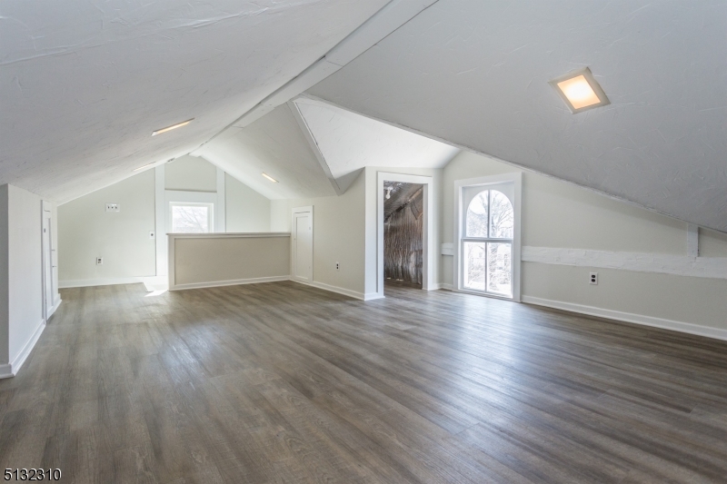 211 Washington Street, Unit 2 Hackettstown, NJ 07840 - Photo 25 of 30 a view of an empty room with wooden floor and a window