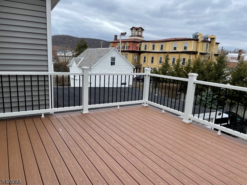 211 Washington Street, Unit 2 Hackettstown, NJ 07840 - Photo 9 of 30 a view of a balcony with wooden floor