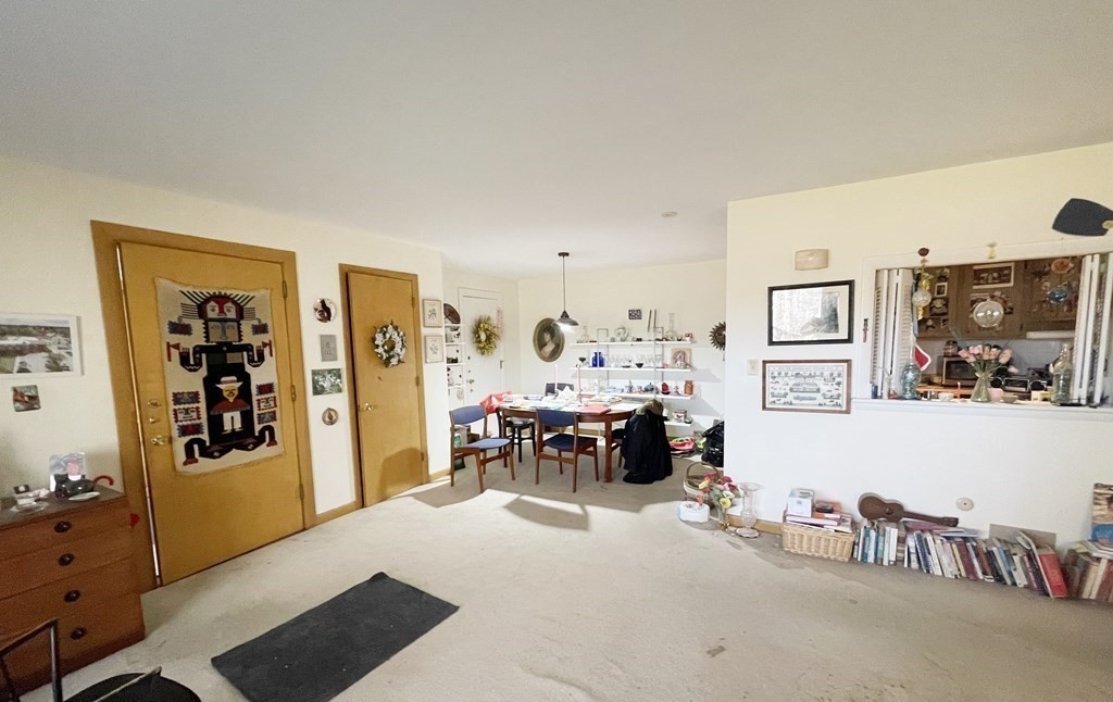 55 Jacqueline Road, Unit 7 Waltham, MA 02452 - Photo 2 of 11 a view of a livingroom with furniture and workspace