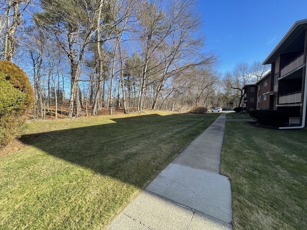 55 Jacqueline Road, Unit 7 Waltham, MA 02452 - Photo 10 of 11 a view of a yard with a house