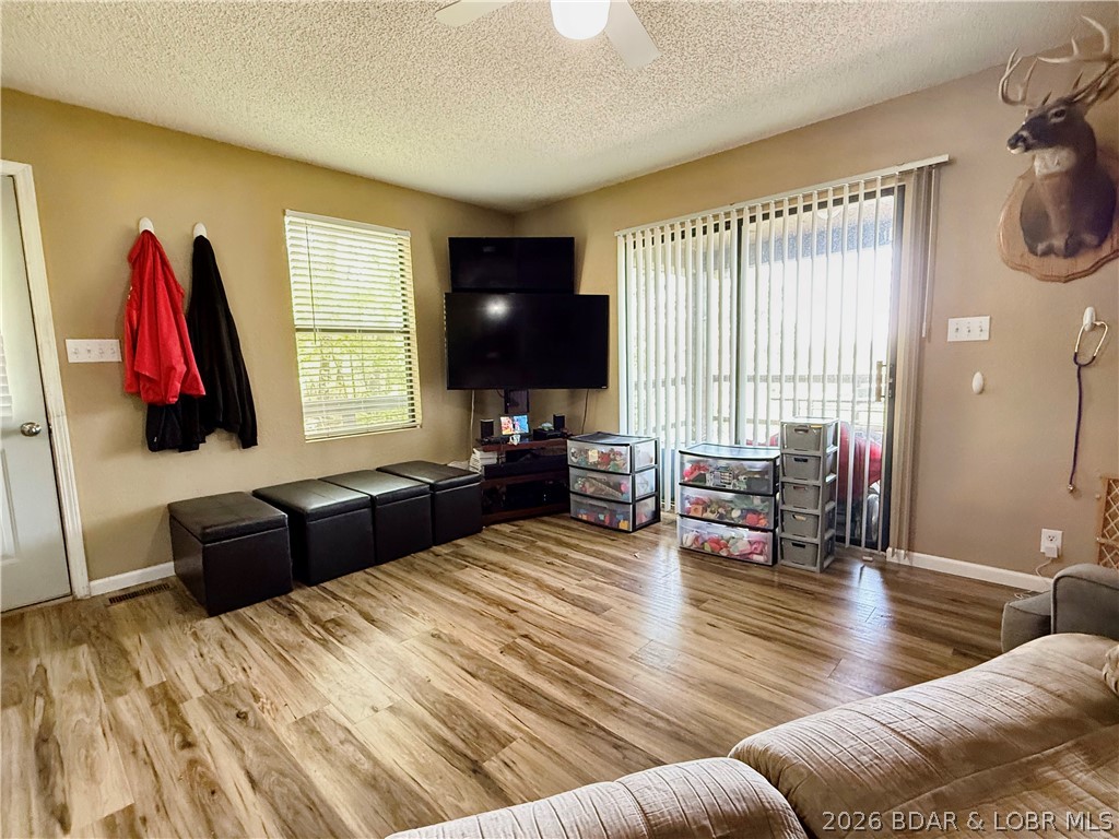 31137 Highland Road Rocky Mount, MO 65072 - Photo 11 of 23 Living Room with sliding door to access deck with