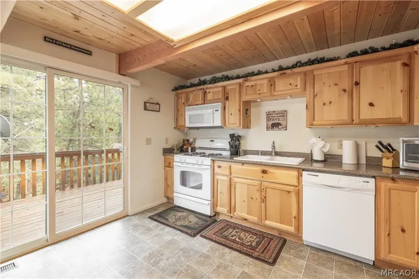 a dining room with furniture and a window