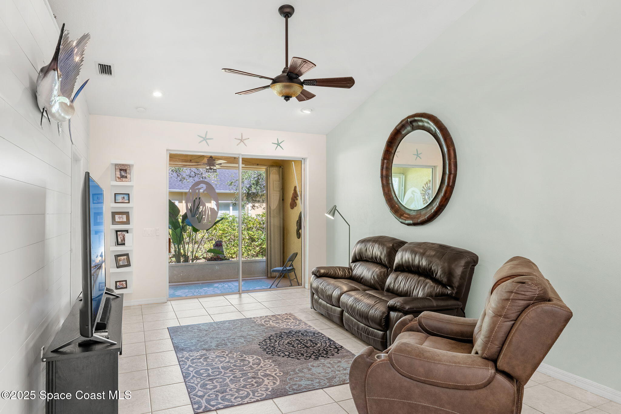 3130 Le Conte Street Melbourne, FL 32940 - Photo 11 of 35 a living room with furniture a rug and a window