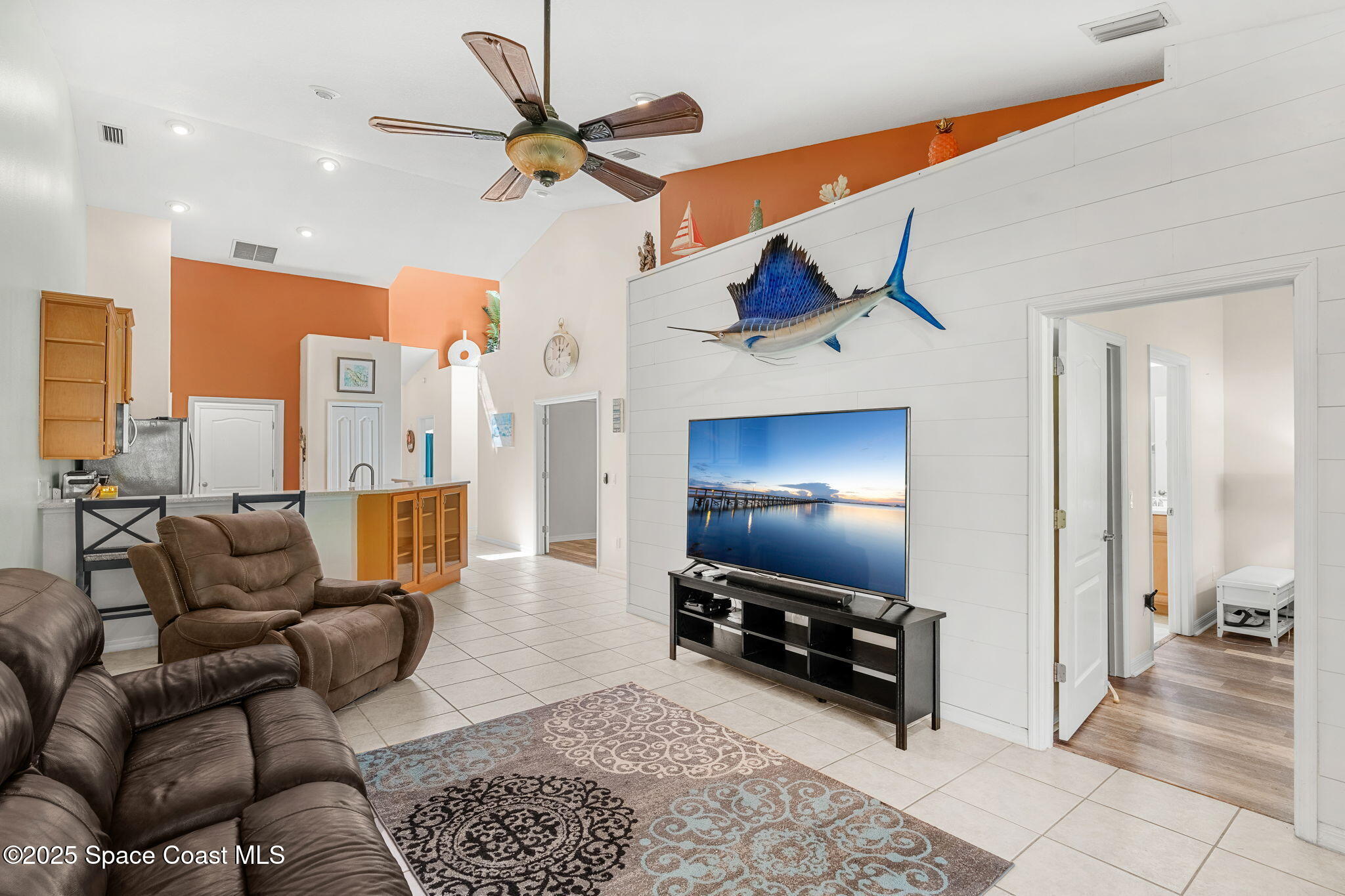 3130 Le Conte Street Melbourne, FL 32940 - Photo 2 of 35 a living room with furniture and a flat screen tv