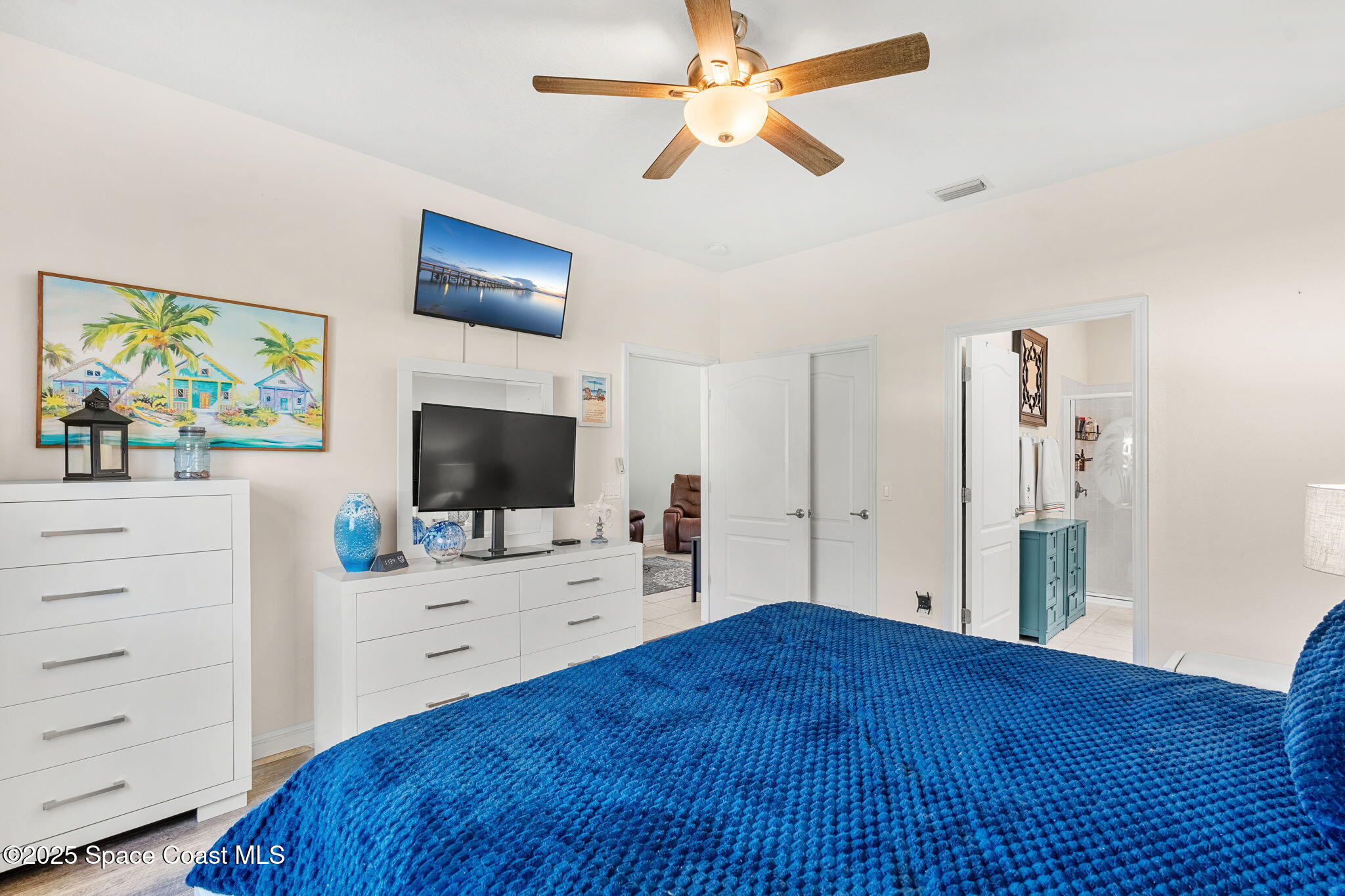 3130 Le Conte Street Melbourne, FL 32940 - Photo 7 of 35 a bedroom with a bed and a flat screen tv