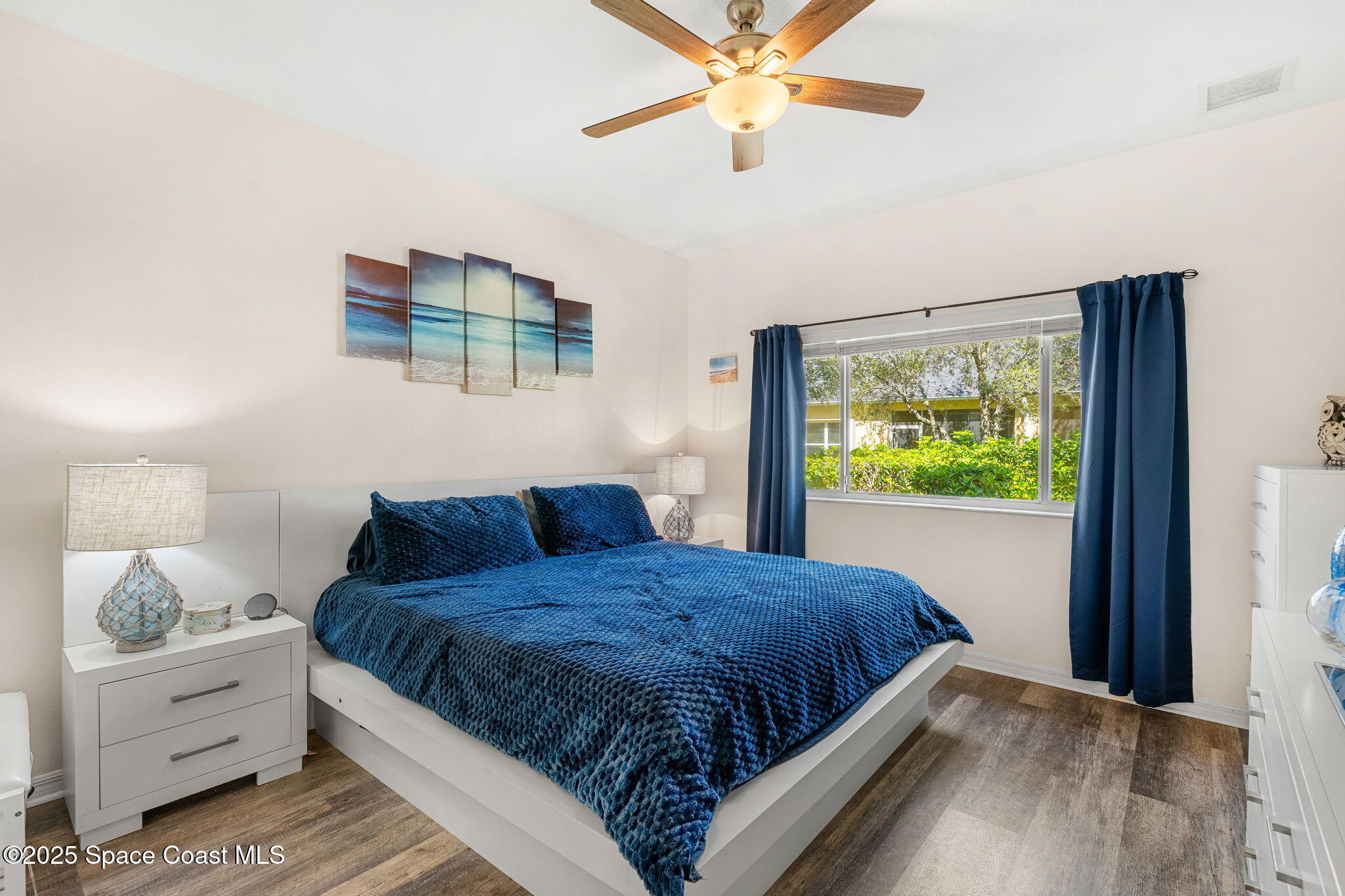 3130 Le Conte Street Melbourne, FL 32940 - Photo 8 of 35 a bedroom with a large bed and a window