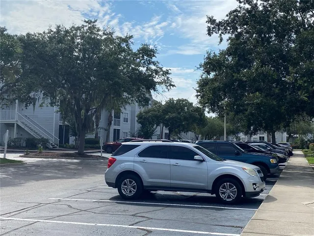 a view of a car parked in front of a house