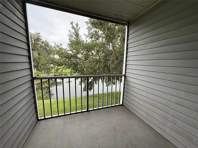 a view of a balcony with wooden floor