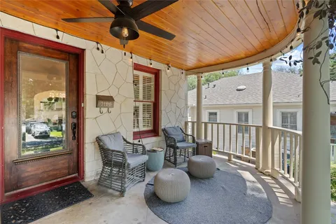 a view of a patio with table and chairs and potted plants