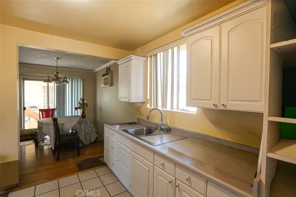 a kitchen with a sink cabinets and appliances