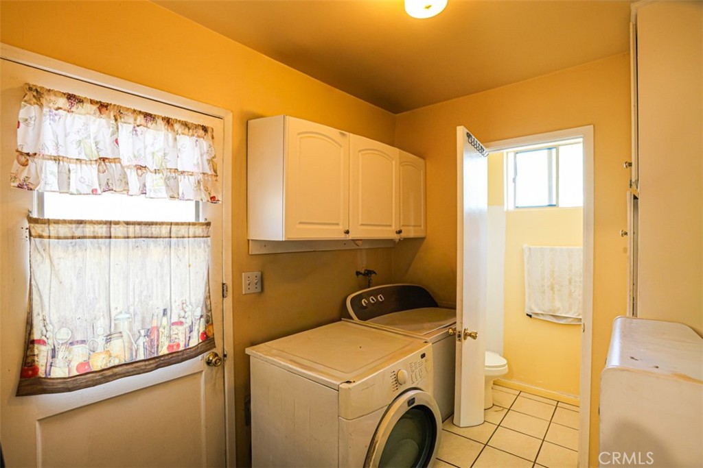 4331 Maxson Road El Monte, CA 91732 - Photo 14 of 32 a view of washer and dryer sitting next to a window
