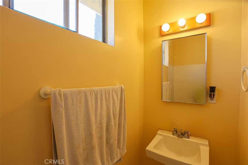 4331 Maxson Road El Monte, CA 91732 - Photo 16 of 32 a bathroom with a sink and mirror