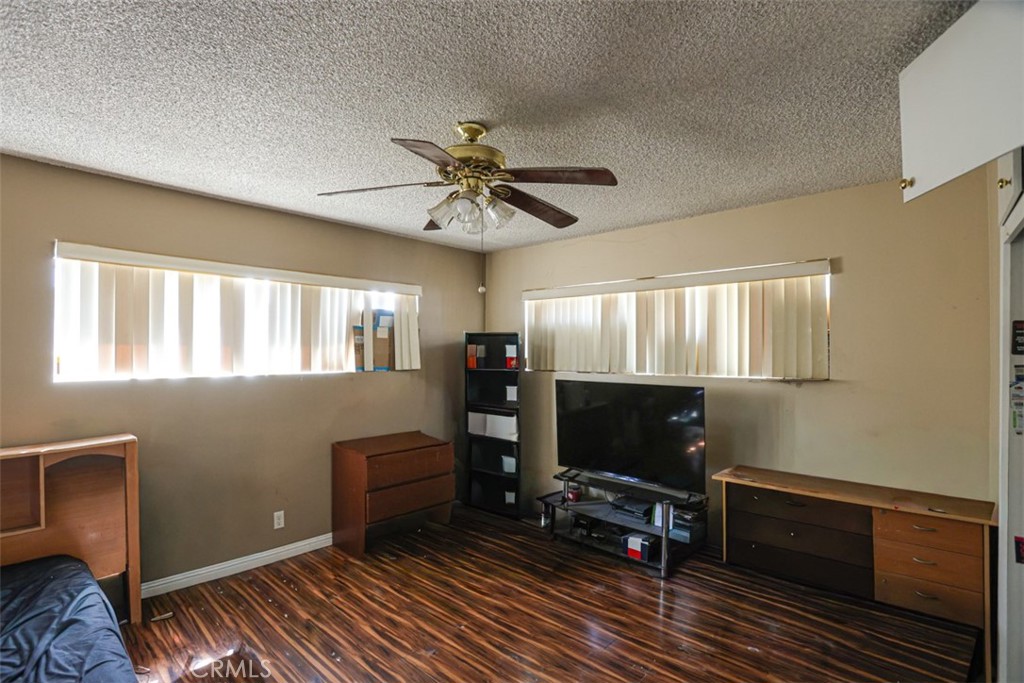 4331 Maxson Road El Monte, CA 91732 - Photo 18 of 32 a living room with furniture a flat screen tv and a fireplace