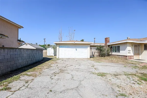 a front view of a house with a wooden fence