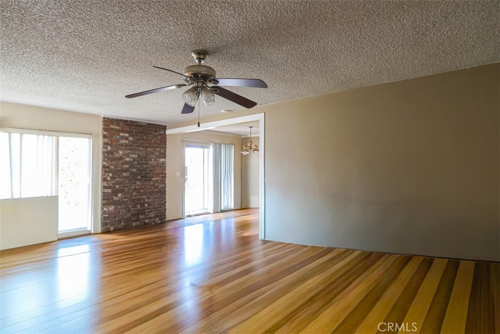 4331 Maxson Road El Monte, CA 91732 - Photo 4 of 32 a view of an empty room with window and wooden floor