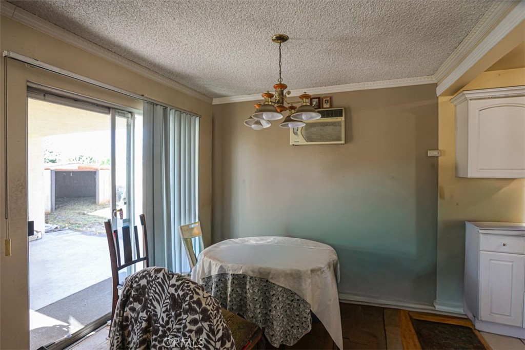 4331 Maxson Road El Monte, CA 91732 - Photo 6 of 32 a bedroom with a bed and a chandelier