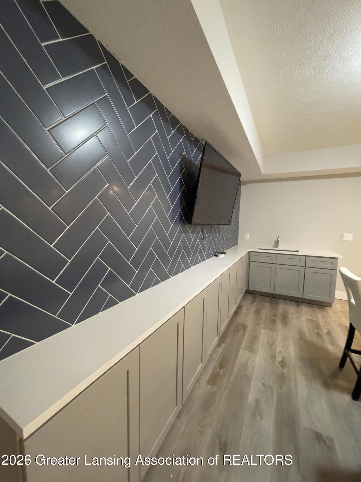 278 East Haslett Haslett, MI 48840 - Photo 41 of 44 Basement Wet Bar