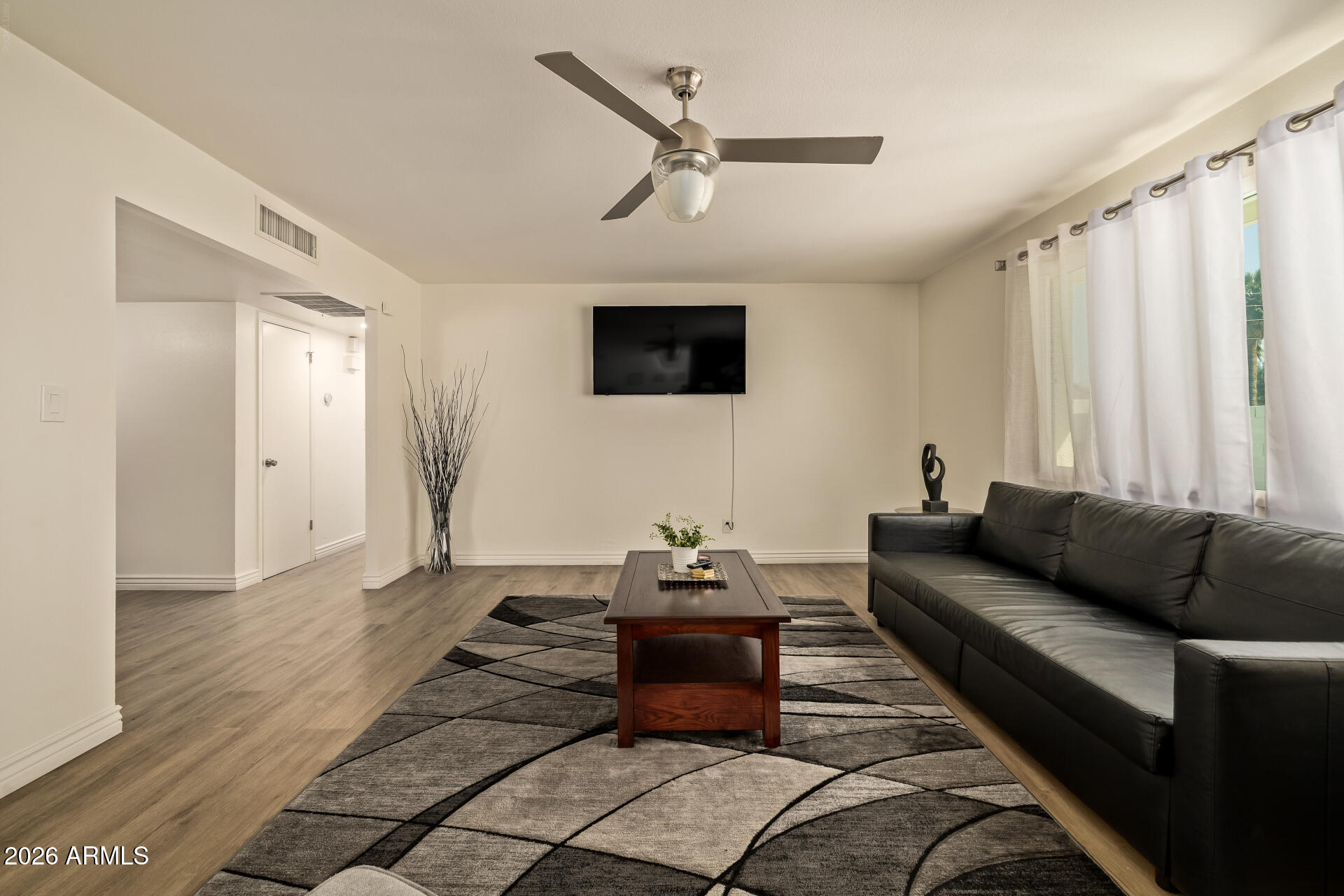 3101 West Shangri-la Road Phoenix, AZ 85029 - Photo 11 of 37 a living room with furniture and a flat screen tv
