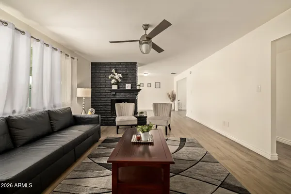 a living room with furniture and a large window
