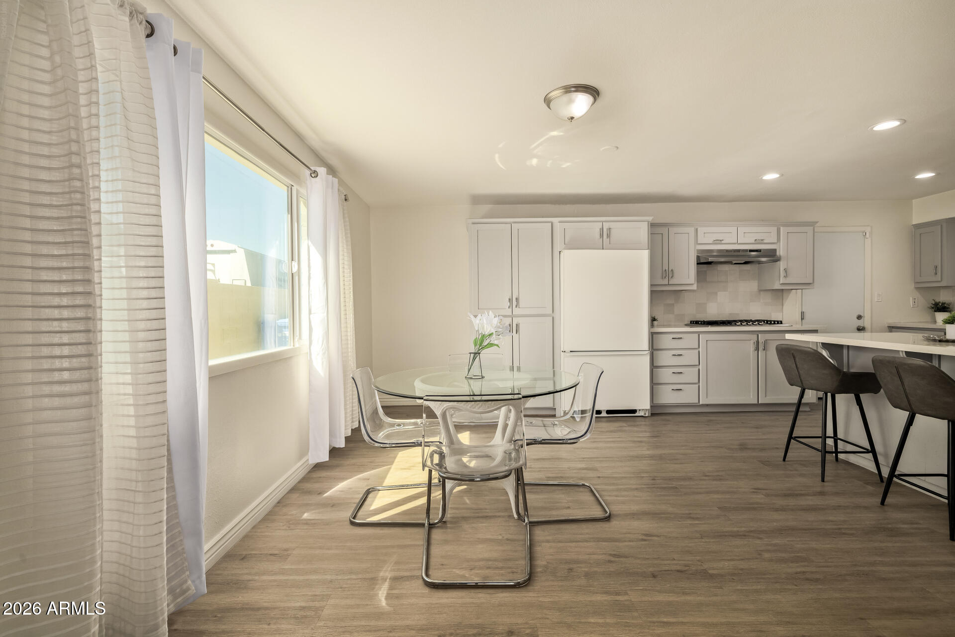 3101 West Shangri-la Road Phoenix, AZ 85029 - Photo 17 of 37 a view of a dining room with furniture and wooden floor