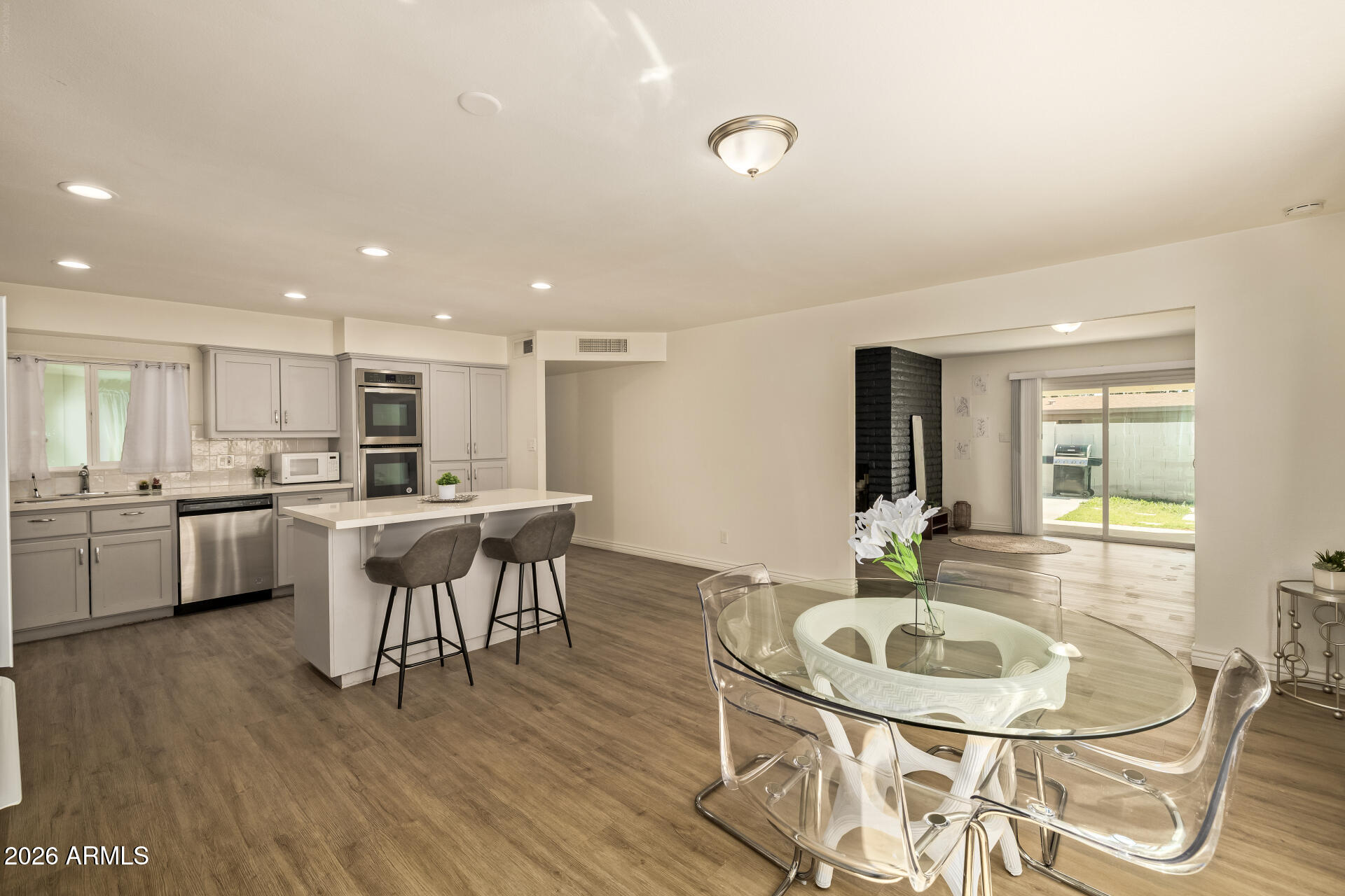 3101 West Shangri-la Road Phoenix, AZ 85029 - Photo 19 of 37 a kitchen with a table and chairs in it