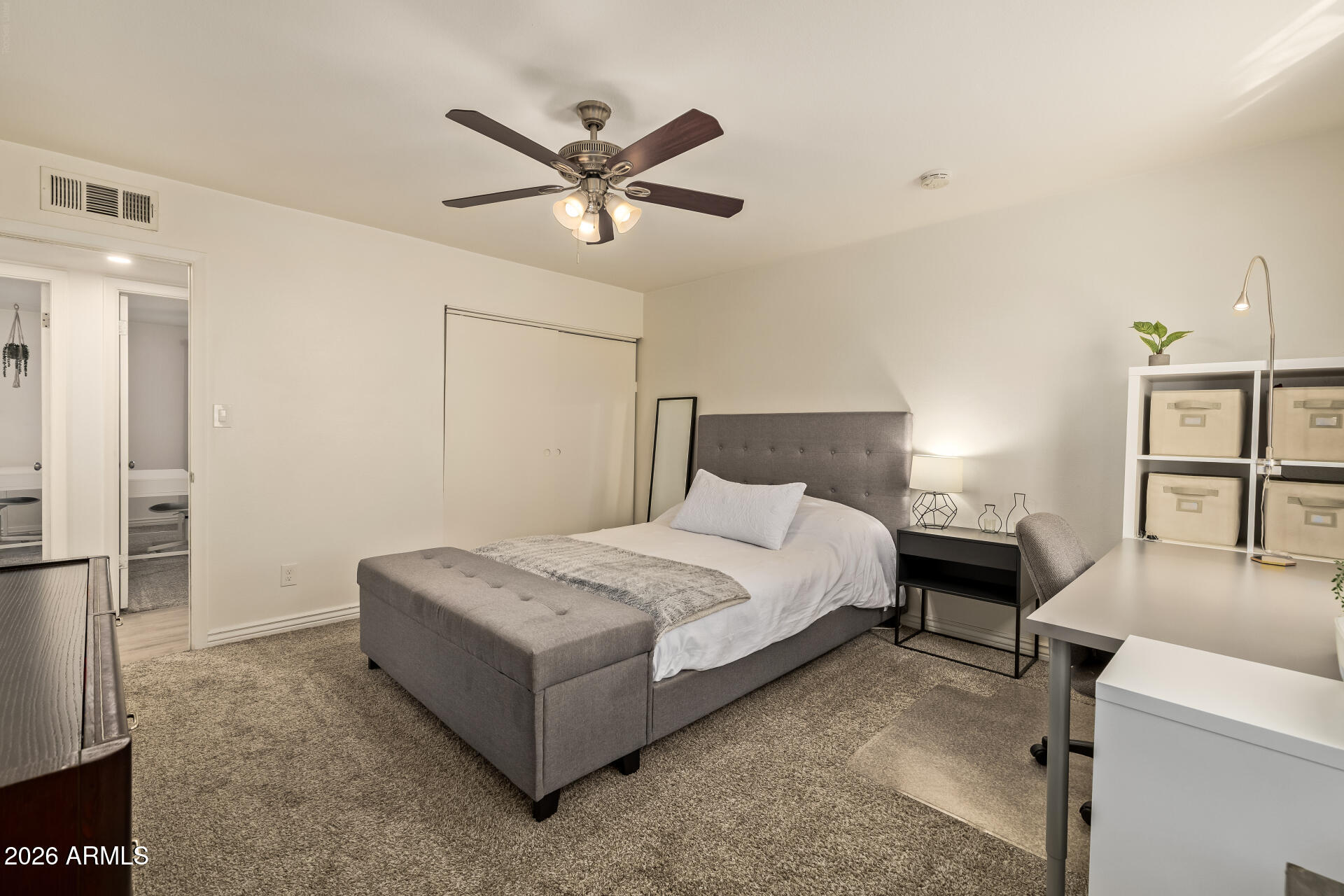 3101 West Shangri-la Road Phoenix, AZ 85029 - Photo 23 of 37 a bedroom with a bed and a chandelier