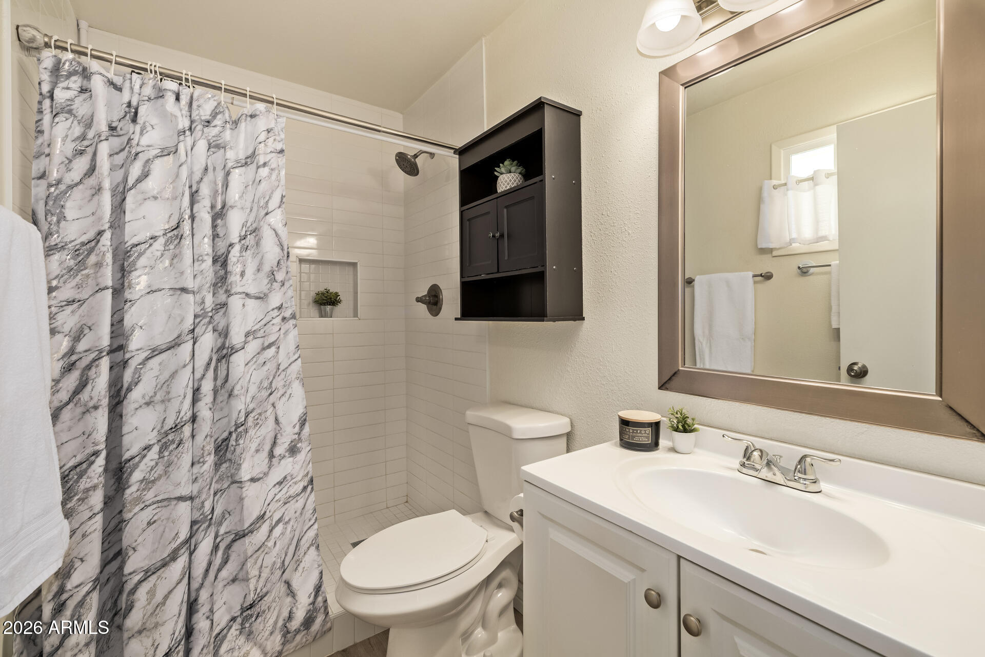 3101 West Shangri-la Road Phoenix, AZ 85029 - Photo 24 of 37 a bathroom with a toilet sink and mirror