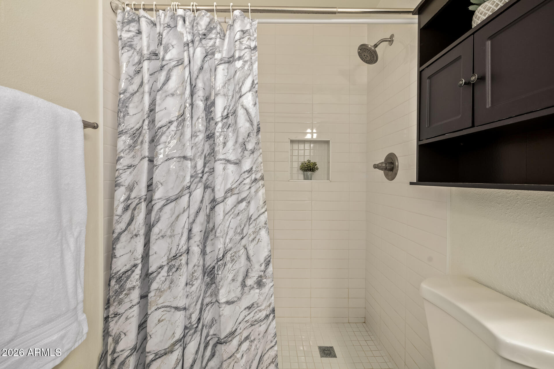 3101 West Shangri-la Road Phoenix, AZ 85029 - Photo 25 of 37 a bathroom with a shower curtain and a sink