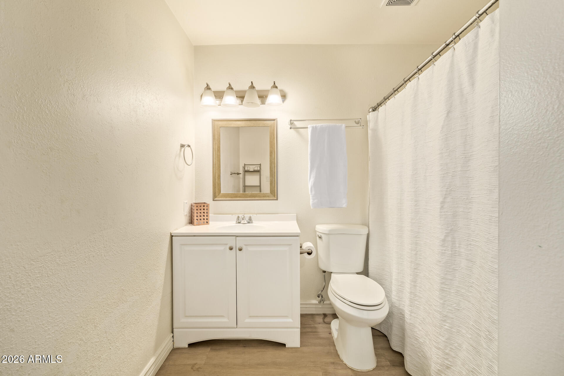 3101 West Shangri-la Road Phoenix, AZ 85029 - Photo 29 of 37 a bathroom with a toilet a sink and a mirror