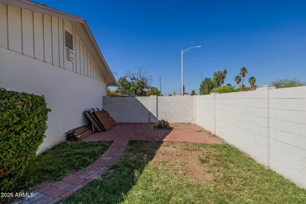 a view of a backyard with potted plants