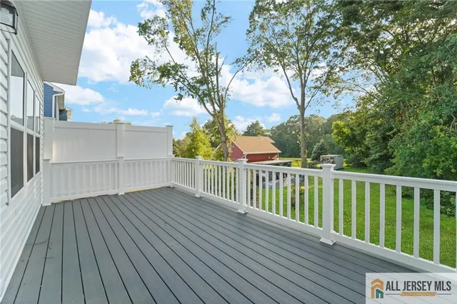 a view of deck with wooden floor and fence