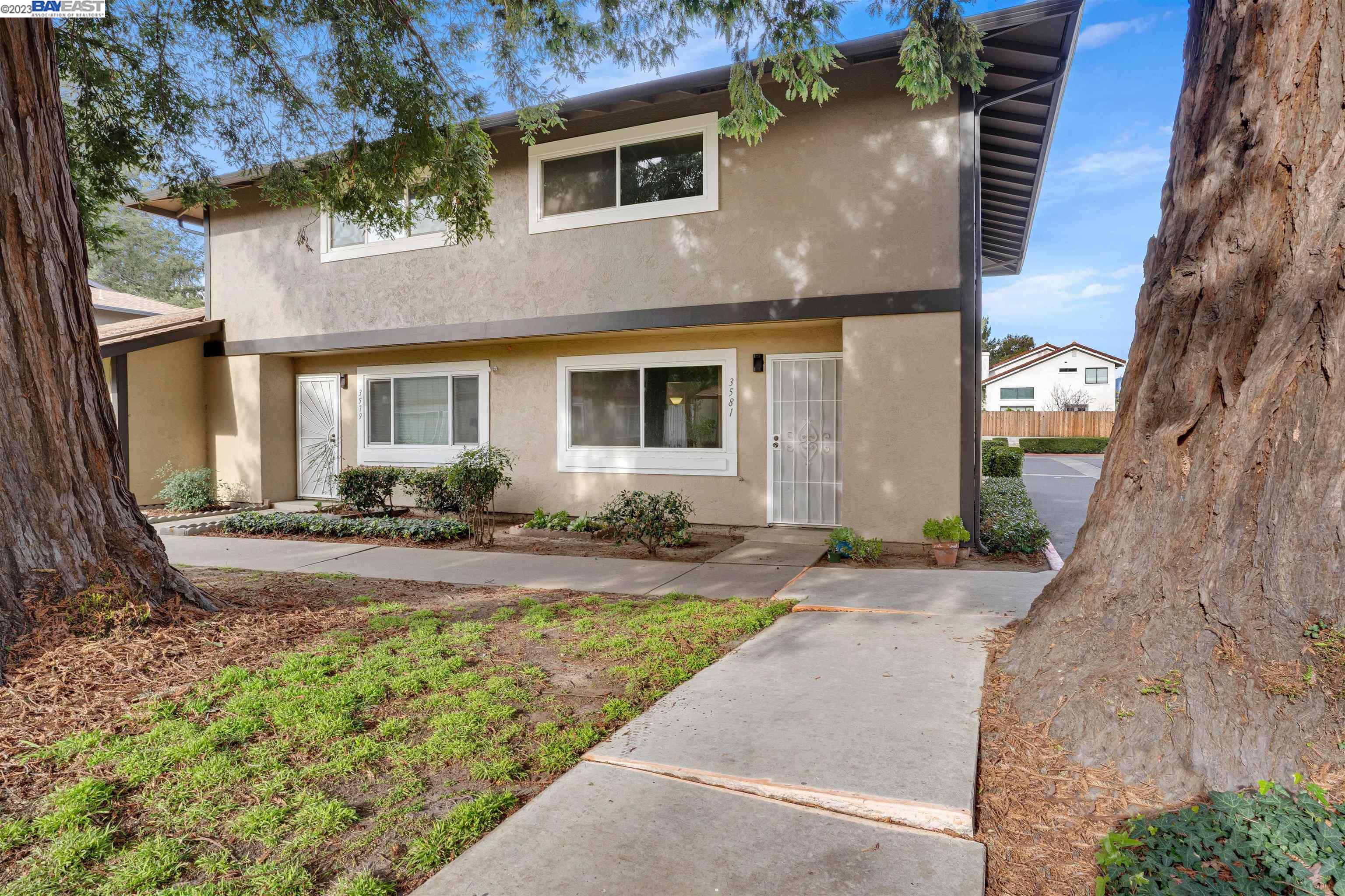 front view of a house with a yard