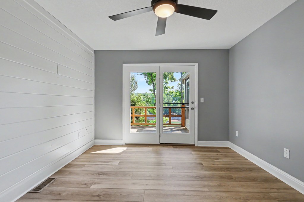 456 Deaver Cove Road Blairsville, GA 30512 - Photo 24 of 83 an empty room with wooden floor and windows
