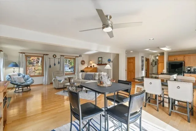 a living room with furniture and kitchen view